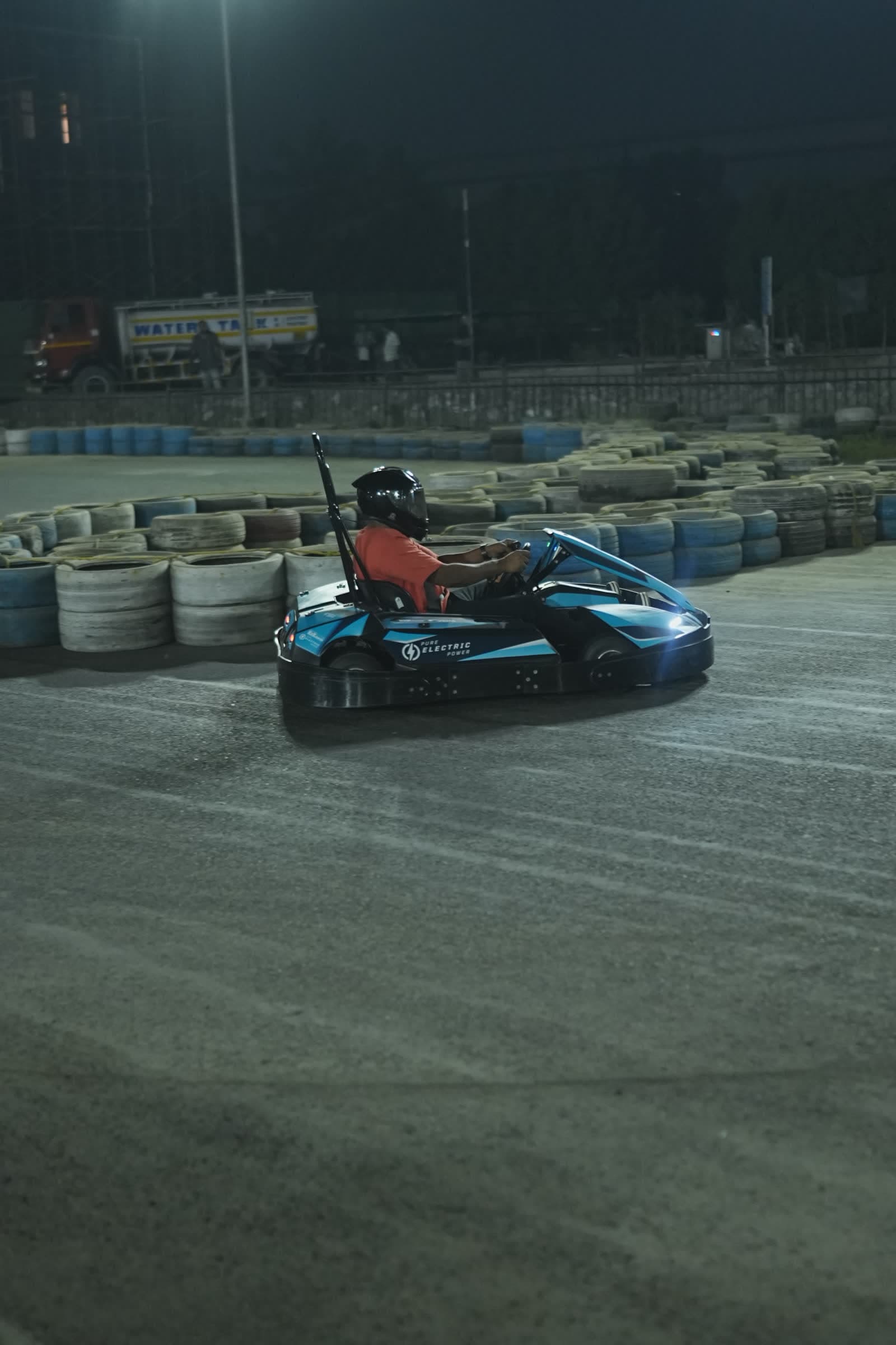 Electric go-karts racing at night